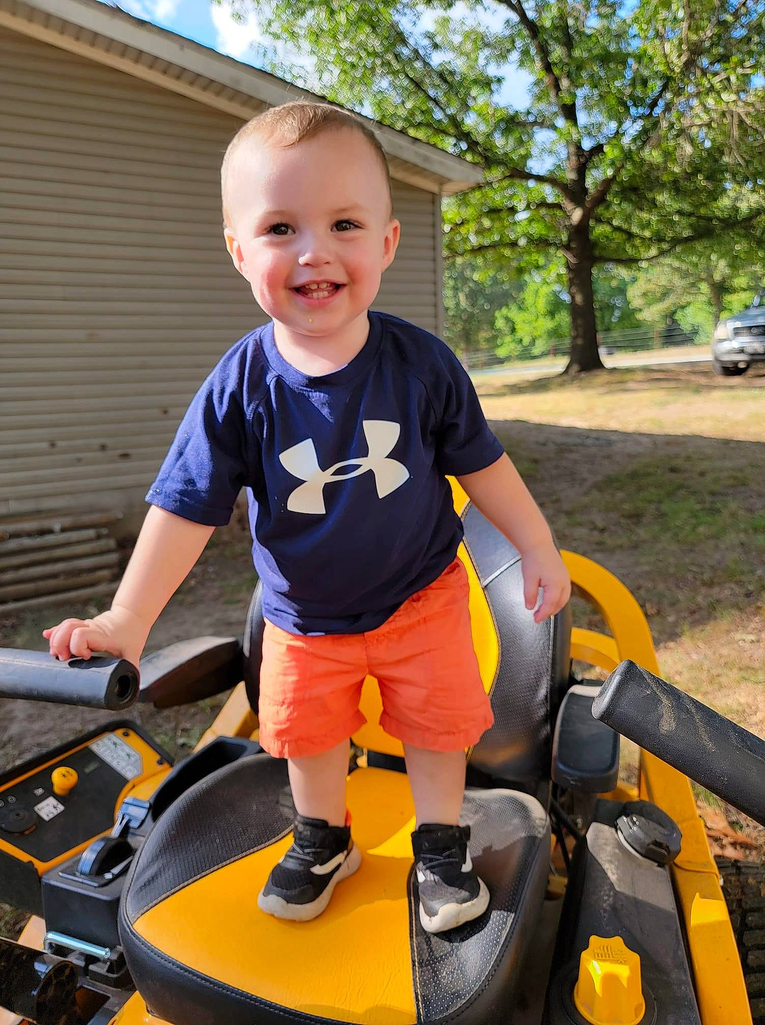 Roan joined the competition — help win amazing prizes! automotive_design, automotive_tire, baby_toddler_clothing, child, electric_blue, fun, grass, happy, joy, leisure, person, plant, recreation, riding_toy, sky, smile, t_shirt, tire, toddler, tree