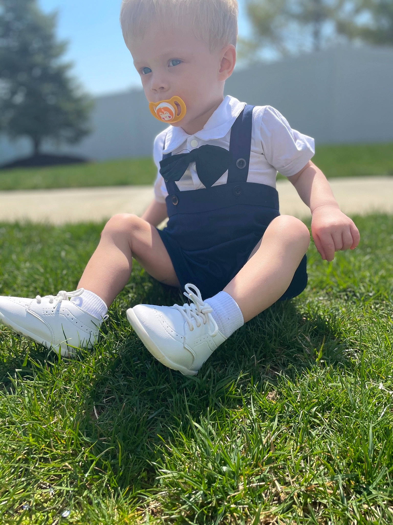 Zayland joined the competition — help win amazing prizes! baby_toddler_clothing, grass, grassland, happy, head, human_leg, knee, lawn, leg, meadow, people_in_nature, person, plant, shoe, shorts, sky, sleeve, summer, thigh, toddler