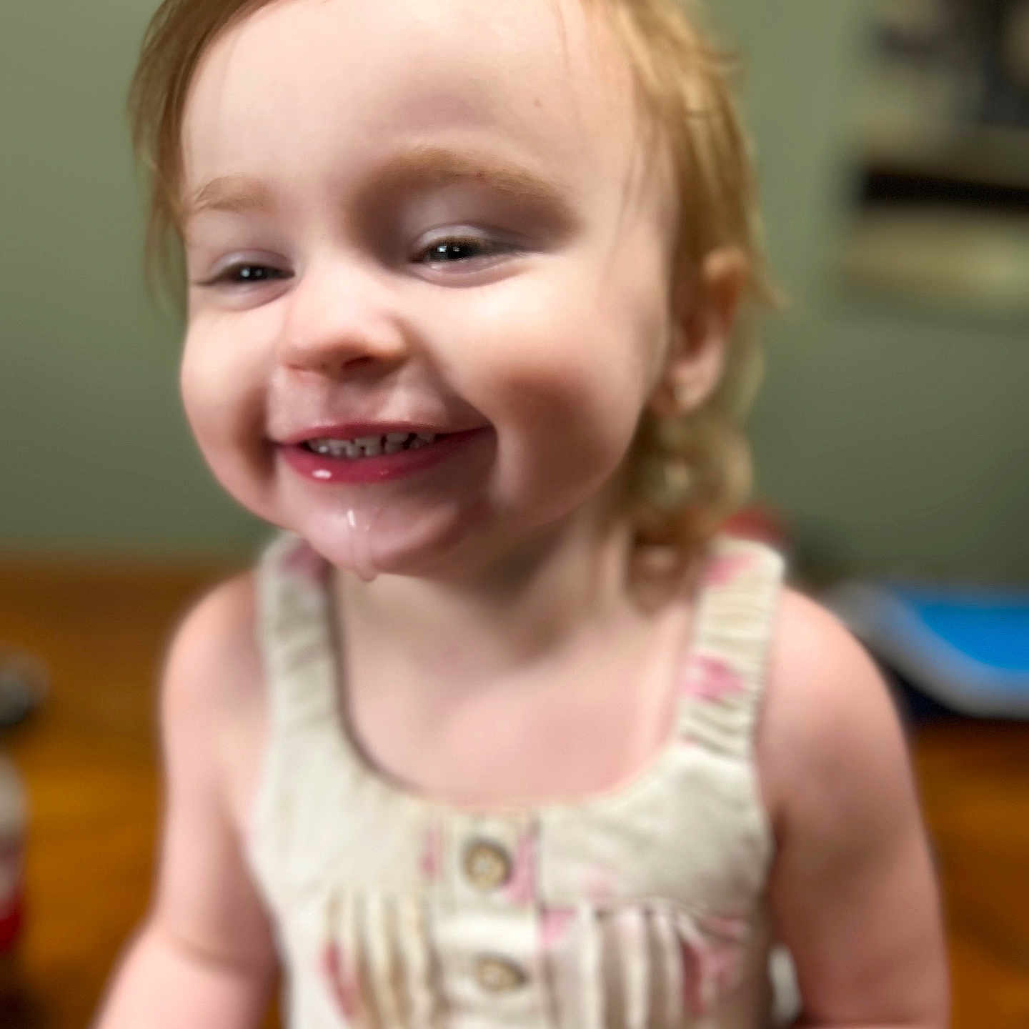 Bailey May joined the competition — help win amazing prizes! baby, blurry_background, buttoned, child, closeup, cute, dress, drool, face, happy, indoor, infant, messy_hair, person, portrait, skin, smiling, toddler, warm_lighting, young_child