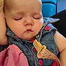 Paislee joined the competition — help win amazing prizes! baby, sleeping, child, portrait, face, indoors, denim, clothing, pink_blanket, holding, adult_arms, blue_chair, cozy, peaceful, closed_eyes, infant, sitting, home, candid, photography