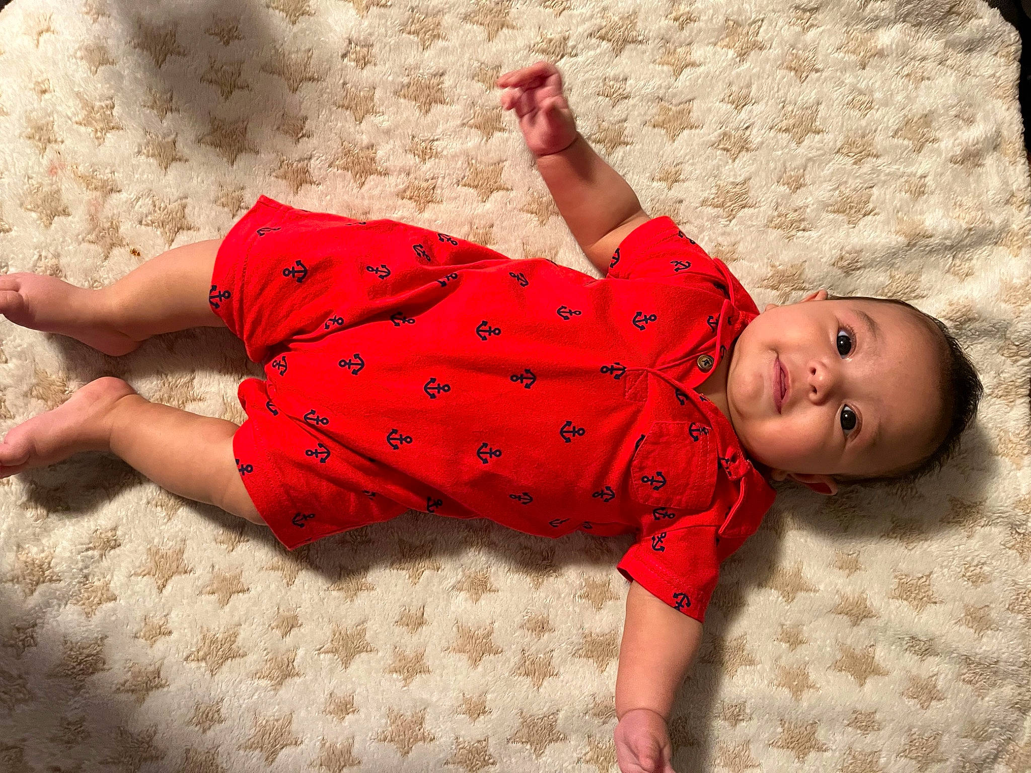 Luis joined the competition — help win amazing prizes! arm, baby, baby_toddler_clothing, clothing, comfort, facial_expression, finger, floor, flooring, foot, human_body, joint, leg, person, red, skin, sleeve, textile, thigh, toddler