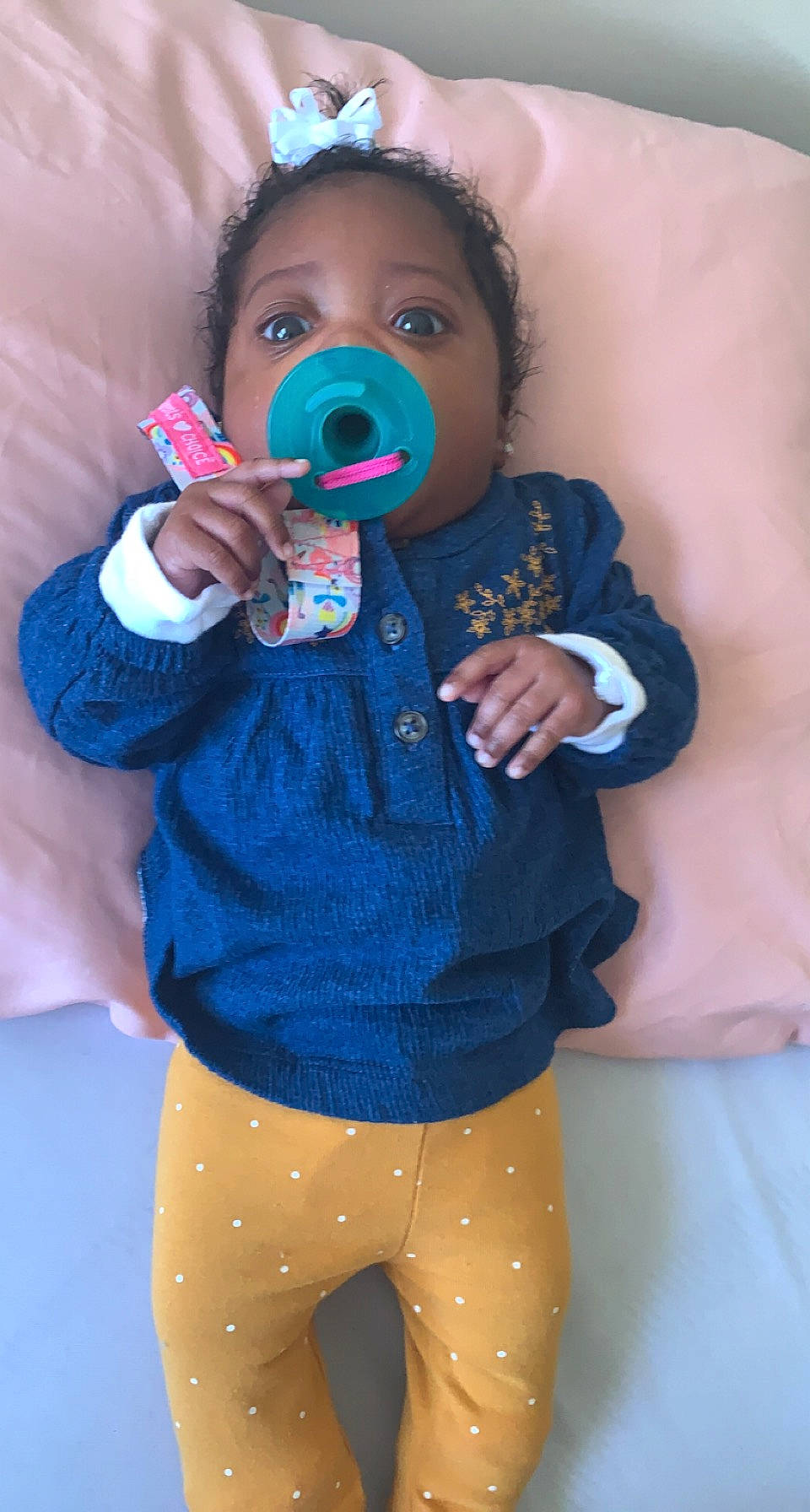 Cassidy is registered to the contest to win money with this photo: azure, baby, baby_toddler_clothing, cheek, eyelash, face, finger, happy, head, iris, lip, mouth, nose, person, product, purple, skin, sleeve, standing, toddler