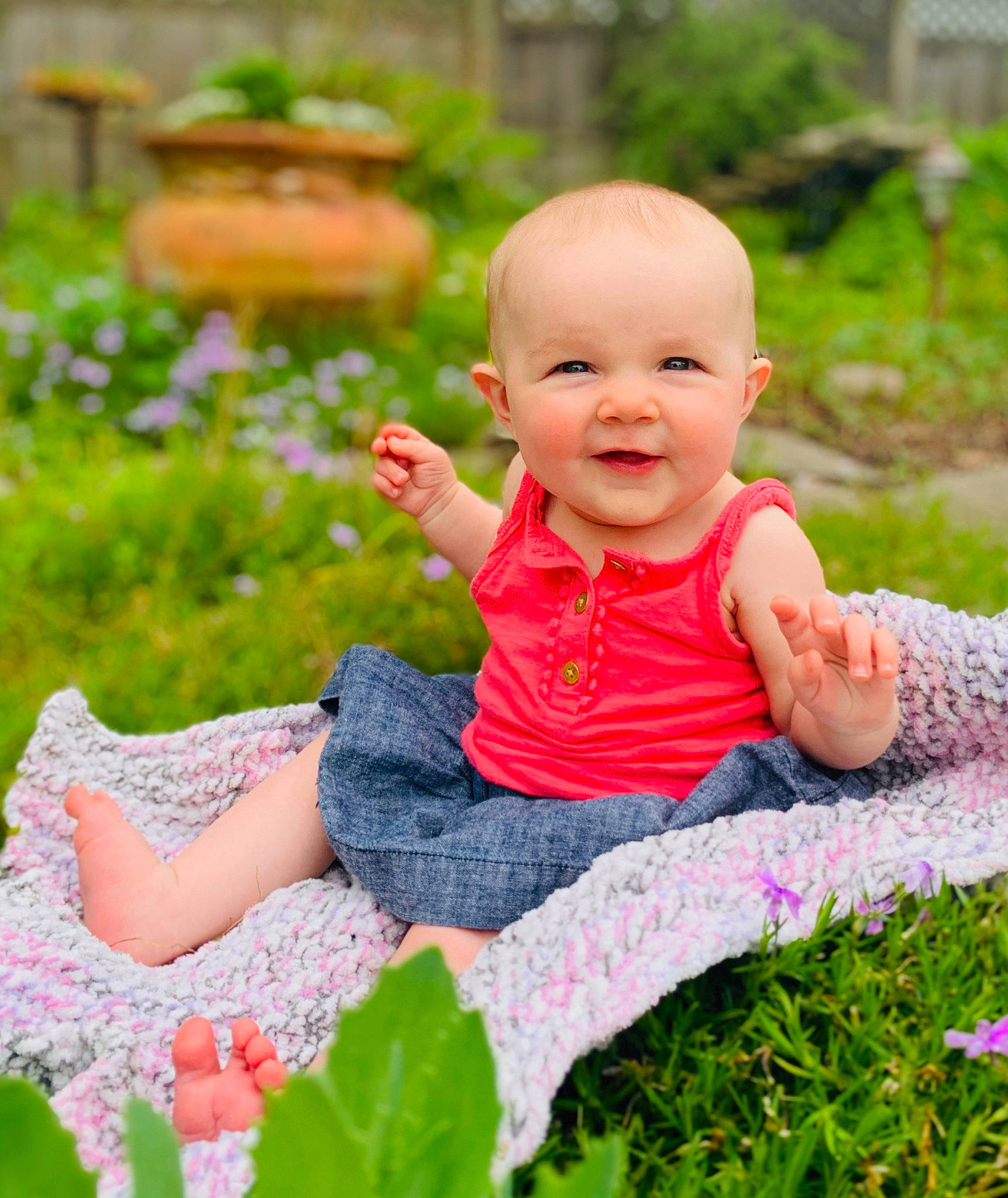 Bonnie is registered to the contest to win money with this photo: baby, beauty, child, finger, garden, grass, happy, joy, people, people_in_nature, person, photograph, photography, pink, plant, product, sitting, skin, smile, spring
