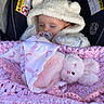 apparel, baby, blanket, car_seat, child, comfort, cozy, crocheted_blanket, cute, face, hooded_jacket, indoors, infant, pacifier, pink, plush_toy, resting, sleeping, soft_toy, white
