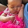 baby, infant, sleeping, baby_girl, pink_tutu, pacifier, closeup, portrait, newborn, closed_eyes, hand, arm, clothing, fabric, lap, soft_lighting, peaceful, cheek, eyelashes, skin