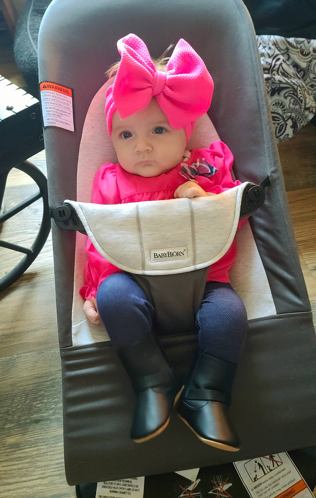 Felicity is registered to the contest to win money with this photo: baby, baby_carriage, baby_products, baby_safety, baby_toddler_clothing, car_seat, chair, child, comfort, eyewear, fashion_accessory, head, headgear, headwear, lap, magenta, person, pink, sitting, tire