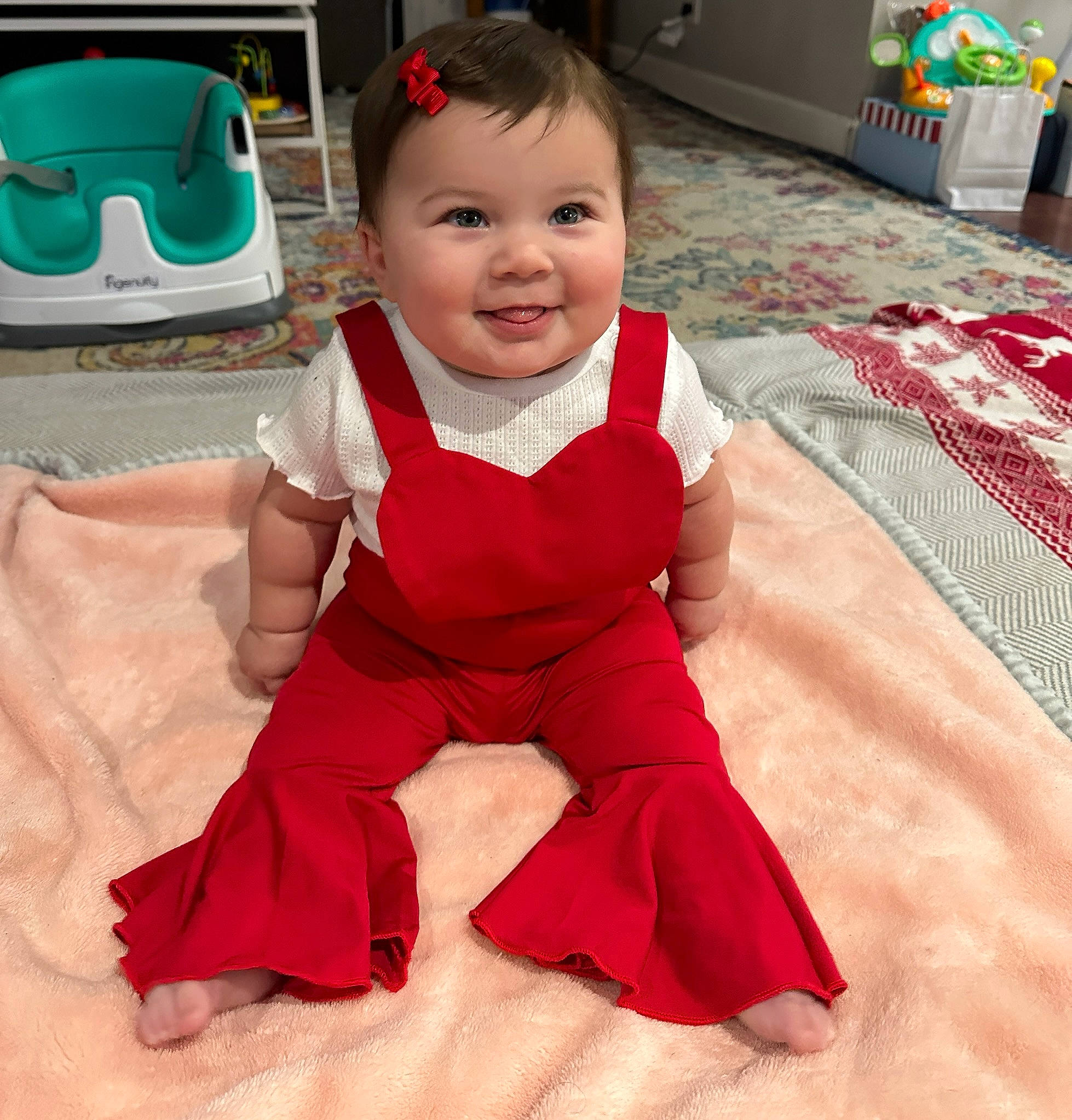 Wrenley joined the competition — help win amazing prizes! baby, baby_toddler_clothing, child, comfort, face, flooring, fun, green, happy, joy, magenta, pattern, person, photograph, pink, product, sitting, skin, sleeve, smile