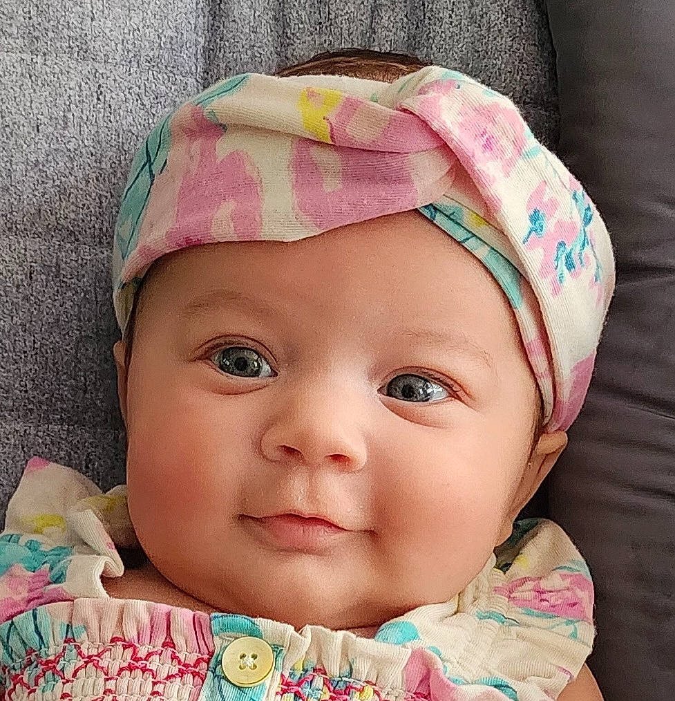 Wrenley is registered to the contest to win money with this photo: baby, cap, cheek, chin, ear, eye, eyebrow, eyelash, face, forehead, hairstyle, happy, head, headwear, iris, lip, nose, person, pink, skin