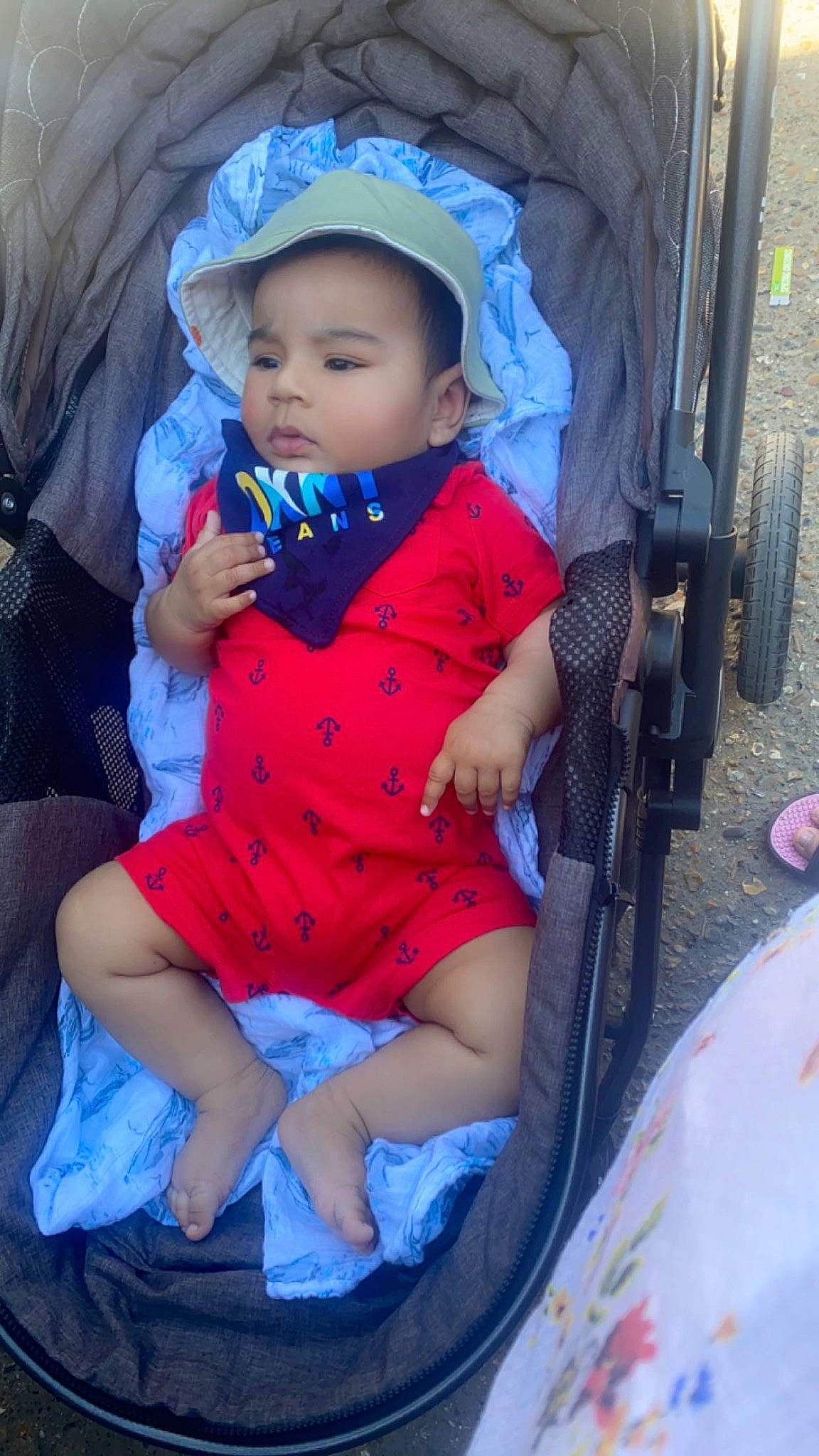 Shan is registered to the contest to win money with this photo: auto_part, baby, baby_carriage, baby_products, baby_toddler_clothing, beauty, car_seat, chair, child, comfort, electric_blue, eye, fun, hat, human_leg, lap, leisure, person, recreation, sitting