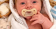Emry is registered to the contest to win money with this photo: baby, pacifier, towel, bath, bubbles, rubber_duck, soap, basket, face, hand, wet_hair, blue_eyes, toy, smile, cute, infant, skin, bathroom, water_drops, plush