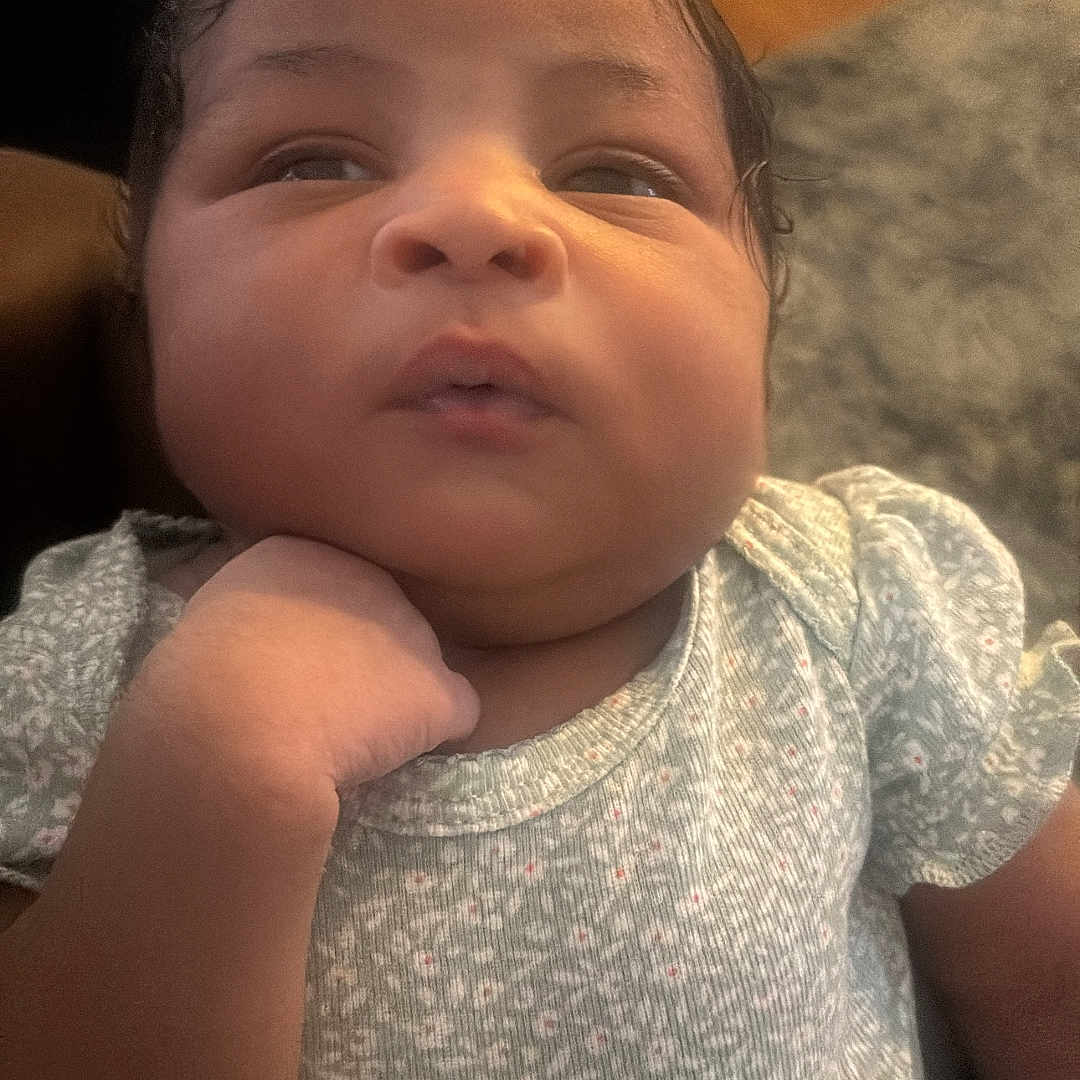 Aolani joined the competition — help win amazing prizes! baby, child, clothing, cute, expression, face, floor, furniture, hand, head, home, indoor, infant, patterned_outfit, person, portrait, skin, sleeve, soft_lighting, young_child