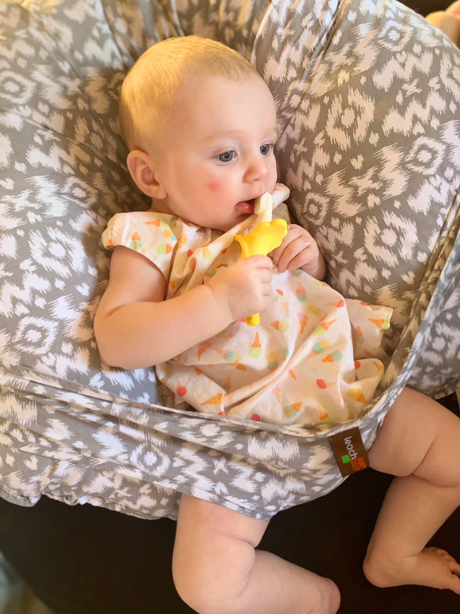 Giavanna is registered to the contest to win money with this photo: baby, baby_toddler_clothing, blond, cheek, child, comfort, dress, eye, finger, fun, happy, head, human_leg, iris, lap, person, skin, sleeve, textile, thigh