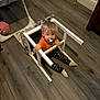 Elijah is registered to the contest to win money with this photo: boy, chair, child, clothing, drawer, face, footwear, furniture, hardwood, head, highchair, hosiery, indoors, interiordesign, male, person, plywood, shoe, sock, wood