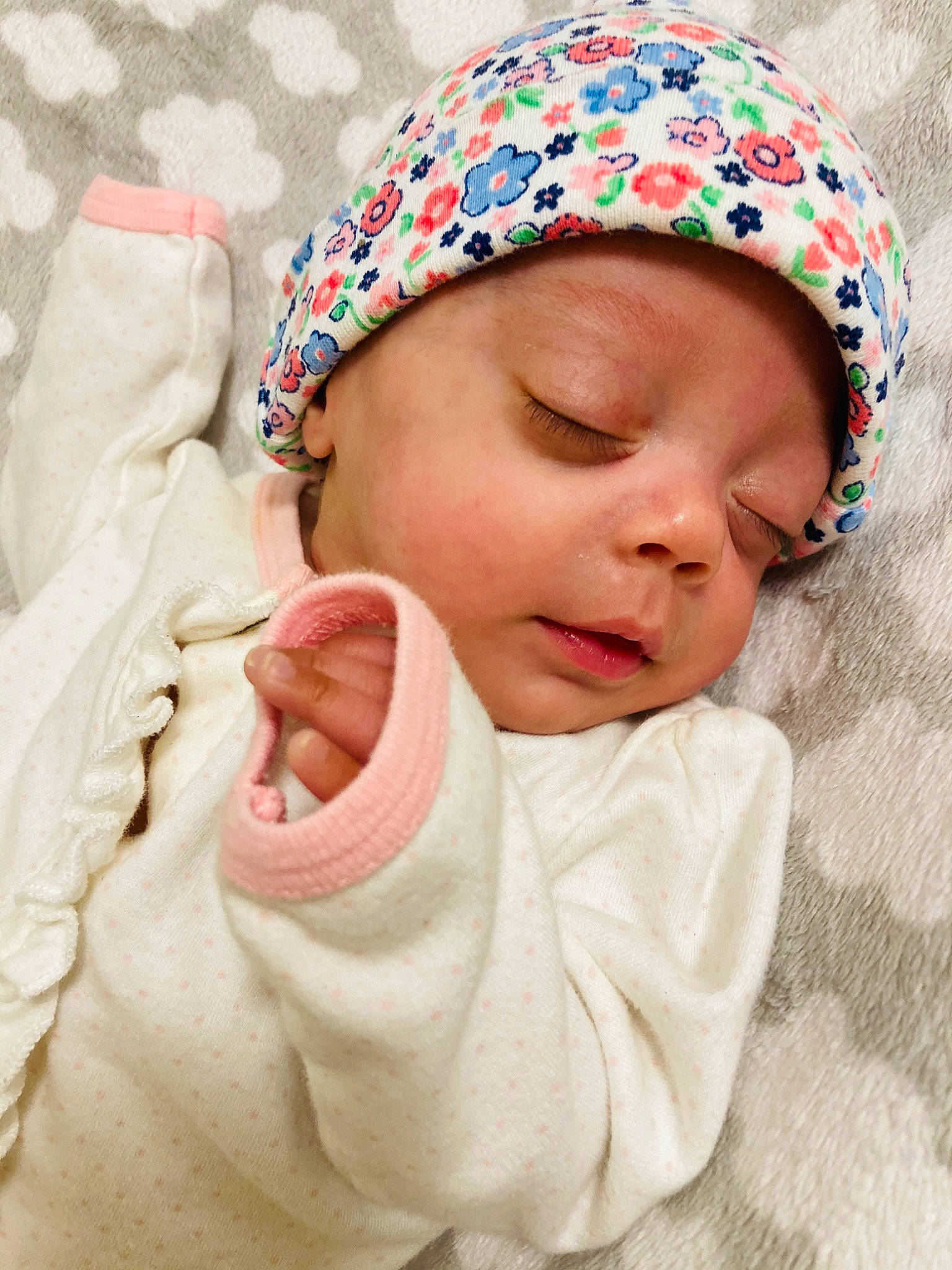 Aisha is registered to the contest to win money with this photo: baby, baby_sleeping, bonnet, cap, cheek, child, fashion_accessory, headgear, headwear, person, pink, skin, smile, toddler