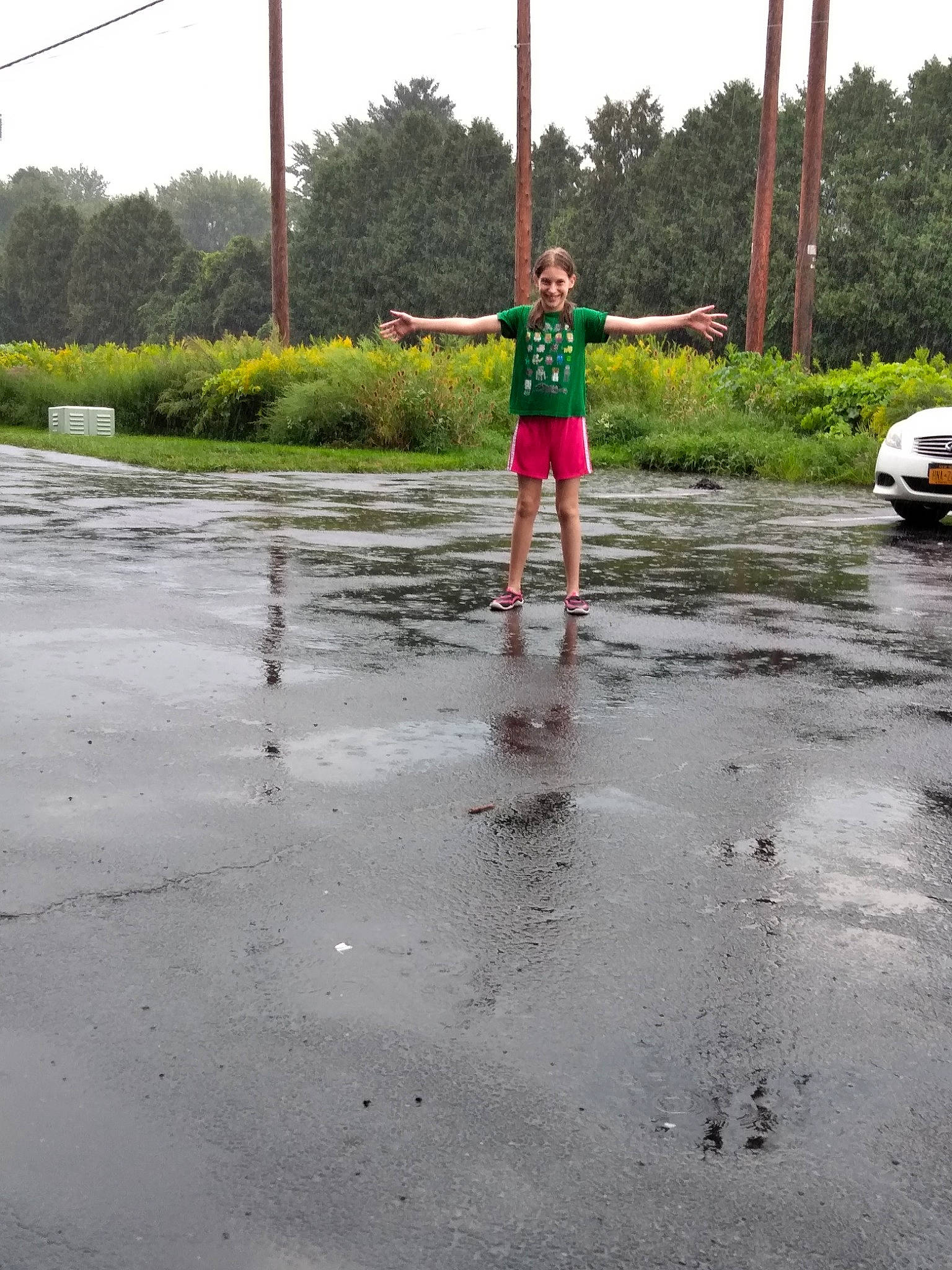 Jadyn joined the competition — help win amazing prizes! asphalt, fun, joy, person, play, puddle, recreation, reflection, road, tree, vacation, water