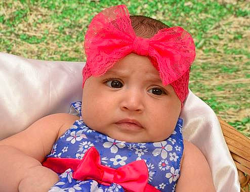 Giana is registered to the contest to win money with this photo: baby, baby_toddler_clothing, bonnet, cap, child, clothing, costume_accessory, ear, face, fashion_accessory, hair_accessory, hat, head, headgear, lip, person, pink, play, skin, sun_hat