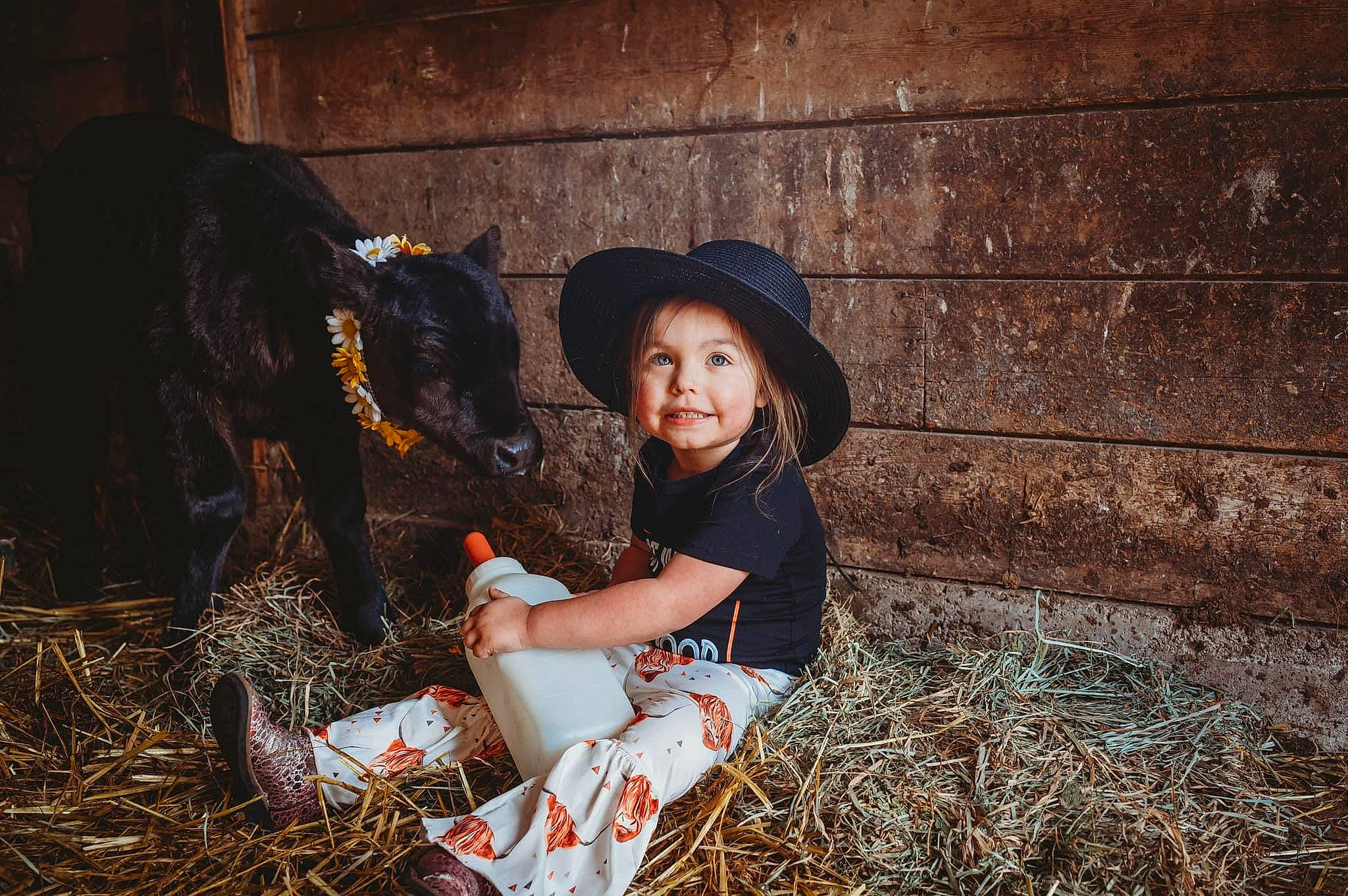 Emersyn is registered to the contest to win money with this photo: agriculture, brown_hair, cap, child, fashion_accessory, field, flash_photography, fun, grass, happy, hat, hay, human_leg, joy, landscape, people_in_nature, person, sitting, soil, straw