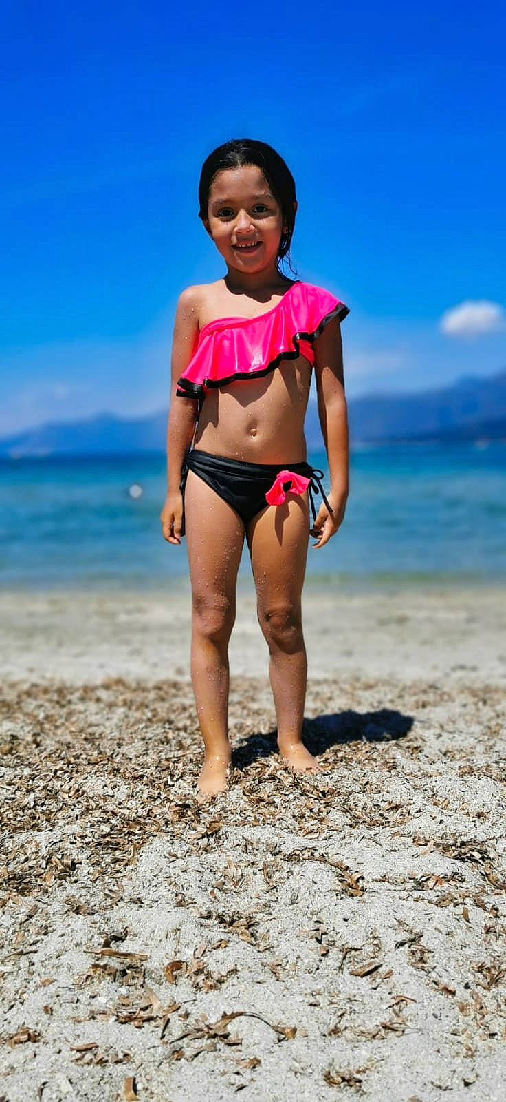 Lyana participe au concours pour gagner de l'argent avec cette photo : barefoot, beach, brassiere, flash_photography, happy, human_body, joy, leg, people_in_nature, people_on_beach, person, shoulder, sky, sunlight, swimsuit_bottom, swimsuit_top, swimwear, thigh, undergarment, underpants