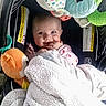 Zalynn is registered to the contest to win money with this photo: baby, blanket, car_seat, child, colorful_toys, cute, face, infant, indoors, plush_toys, portrait, smile, soft_texture, toy_elephant, toy_snake, warm, wrapped, young_child, happy, seated