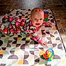 Zalynn joined the competition — help win amazing prizes! baby, child, crawling, pajamas, toy, colorful, patterned_mat, floor, happy, smiling, indoors, playtime, cute, infant, bright, natural_light, elephant_pattern, person, young_child, flooring