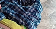Zalynn is registered to the contest to win money with this photo: toddler, child, blanket, plaid, pacifier, chair, floor, tile_floor, playpen, toys, indoor, home, young_child, baby, person, seated, cozy, looking_away, comfort, childhood