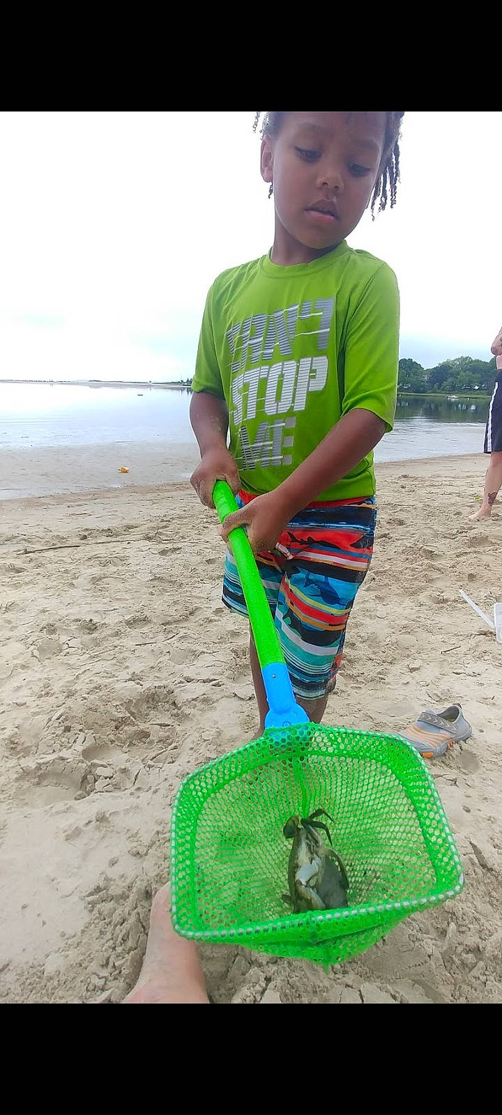 Jamal is registered to the contest to win money with this photo: automotive_tire, automotive_wheel_system, cloud, electric_blue, fun, grass, headwear, ocean, person, recreation, reptile, sand, scaled_reptile, serpent, shorts, sky, sleeve, slipper, soil, t_shirt