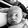 Kaden is registered to the contest to win money with this photo: baby, newborn, sleeping, close_up, black_and_white, peaceful, infant, face, arm, skin, portrait, resting, child, human, cute, soft_light, indoors, tender, calm, person