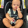 Kaden joined the competition — help win amazing prizes! baby, car_seat, child, infant, onesie, safety_harness, cute, expression, finger, pucker, seatbelt, warning_label, indoor, legs, feet, skin, head, face, person, sitting