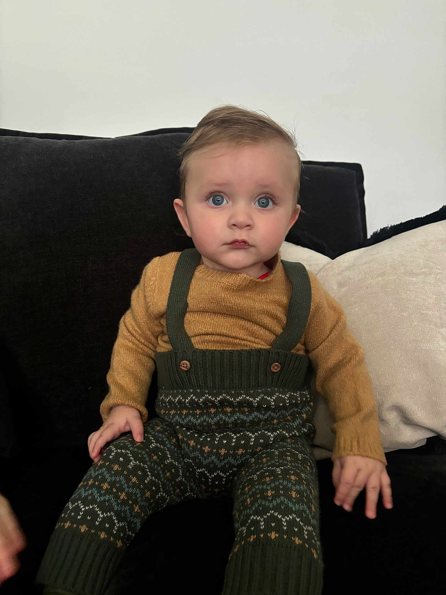 Atlas joined the competition — help win amazing prizes! toddler, child, baby, sitting, couch, clothing, knitwear, patterned_pants, suspenders, sweater, face, blue_eyes, hand, indoor, furniture, portrait, expression, fashion, cute, young_child