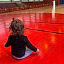 Leana participe au concours pour gagner de l'argent avec cette photo : child, competition_event, floor, flooring, fun, hardwood, leisure, red, sitting, sport_venue, sports, wood_flooring