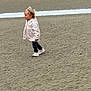 child, toddler, sand, beach, walking, jacket, pink_shoes, outdoor, casual_clothing, young_child, footwear, nature, side_view, small_person, daylight, texture, ground, person, apparel, adventure