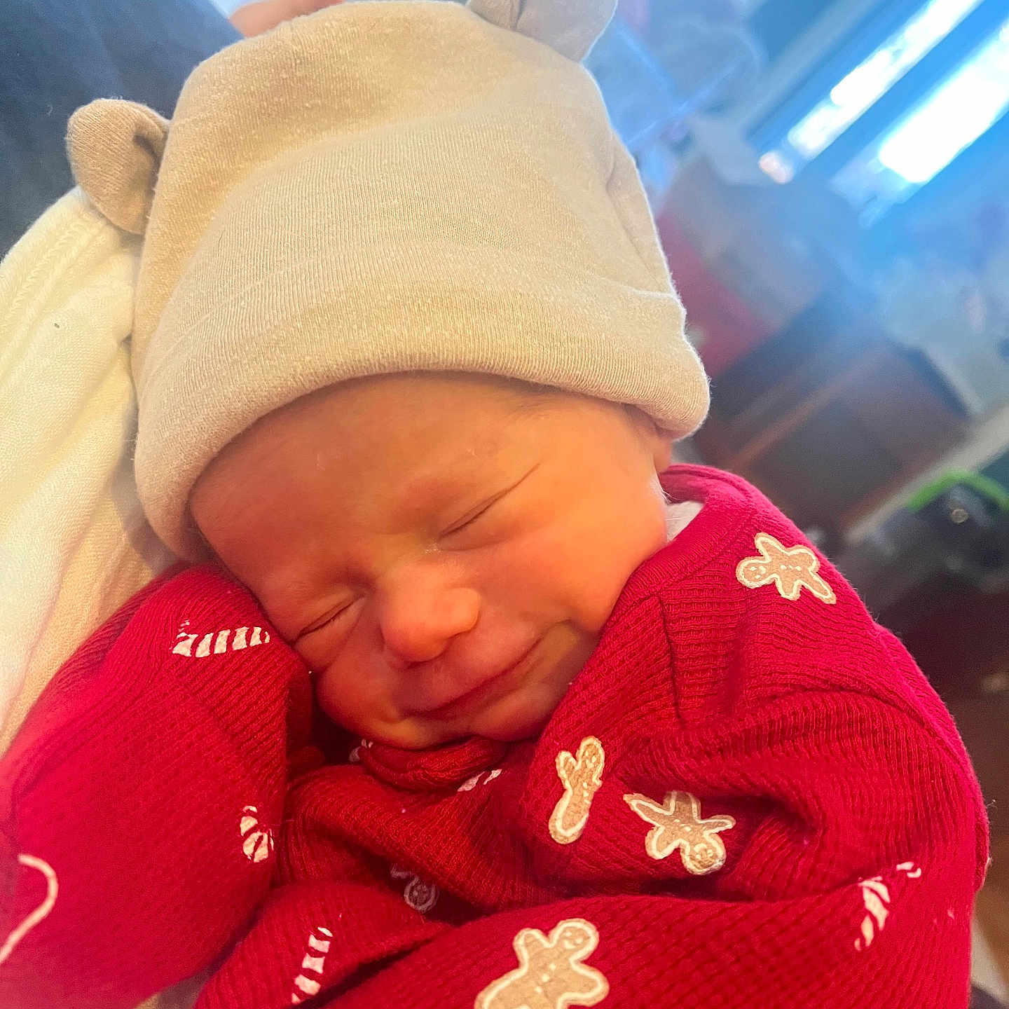 Wesley joined the competition — help win amazing prizes! baby, beige, child, closeup, cozy, cute, festive, gingerbread_men, hat, indoor, infant, newborn, person, portrait, red_clothing, sleeping, smiling, snuggled, soft_light, warm