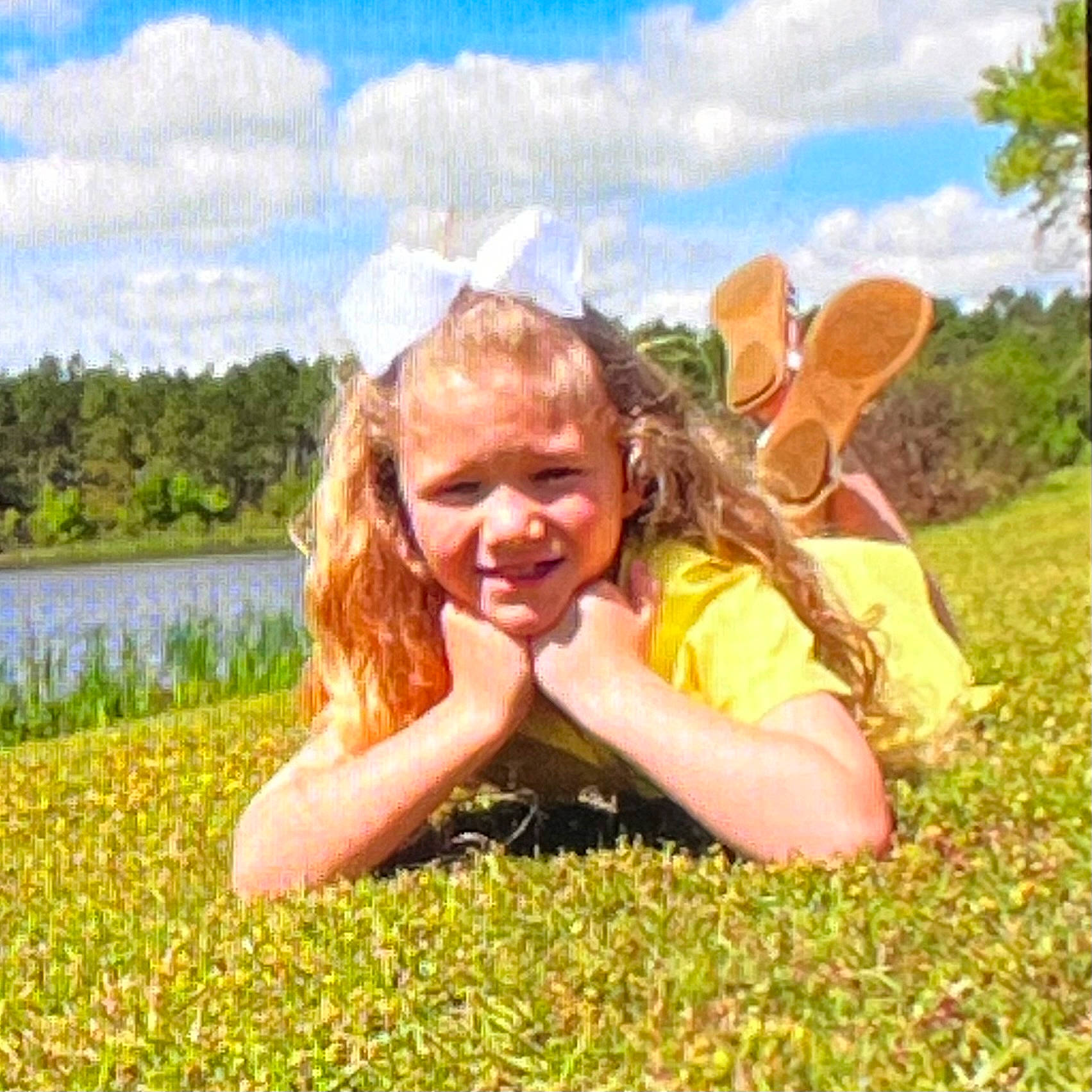 Carleigh is registered to the contest to win money with this photo: blond, cloud, field, fun, grass, grassland, happy, joy, landscape, leisure, meadow, natural_landscape, pasture, people_in_nature, person, plant, prairie, sitting, sky, smile