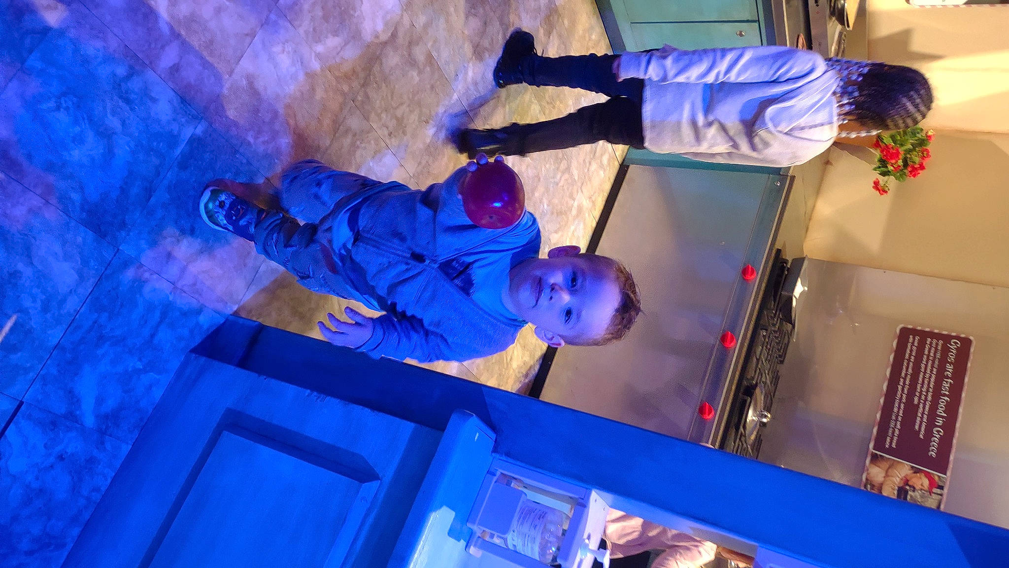 Oliver is registered to the contest to win money with this photo: azure, blue, electric_blue, entertainment, event, fun, hat, houseplant, light, magenta, performance, performance_art, performing_arts, person, plant, purple, red, room, tree, violet