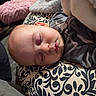 Maddox joined the competition — help win amazing prizes! baby, sleeping, infant, child, portrait, indoors, blanket, cushion, patterned, clothing, camouflage, cozy, peaceful, resting, face, closed_eyes, nose, mouth, home, photography