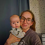 Maddox joined the competition — help win amazing prizes! baby, infant, adult, parent, 抱抱, selfie, portrait, indoors, curtains, wallpaper, glasses, smiling, family, holding, onesie, mickey_mouse, clothing, home, photograph, faces