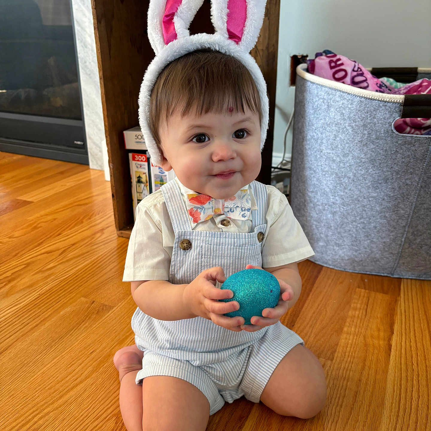Amari is registered to the contest to win money with this photo: astronomy, baby, clothing, couch, face, furniture, hardwood, hat, head, indoors, interiordesign, outerspace, person, photography, plywood, portrait, shorts, sitting, sphere, wood