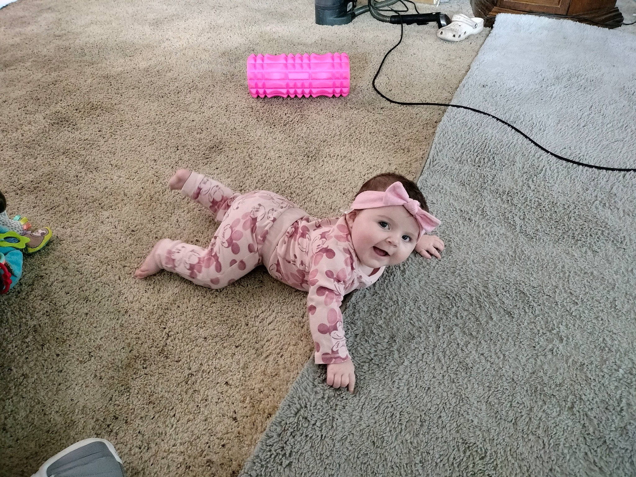 Jaelynn is registered to the contest to win money with this photo: baby, baby_toddler_clothing, carpet, child, comfort, companion_dog, floor, flooring, foot, fur, grass, headwear, linens, pattern, person, pink, play, sitting, stuffed_toy, tail