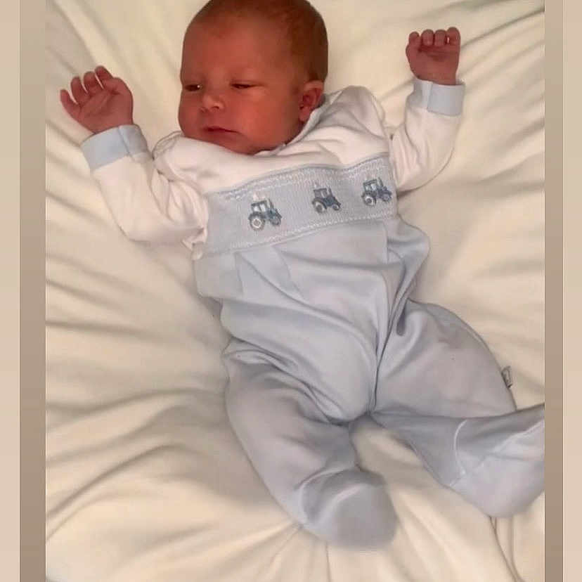 Henry-Joseph is registered to the contest to win money with this photo: architecture, baby, babylaughing, bed, bodypart, building, cushion, face, finger, furniture, hand, happy, head, hospital, newborn, person, photography, portrait, sleeping, smile