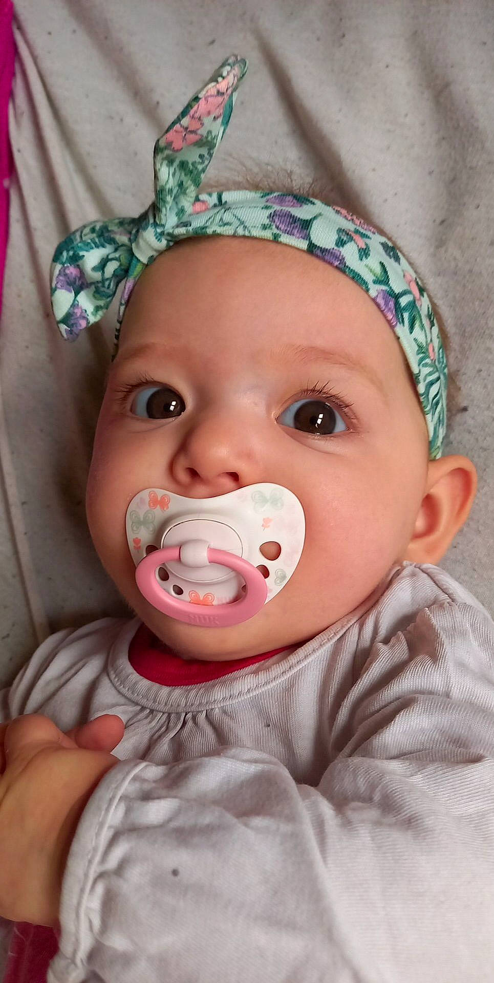 Malyana participe au concours pour gagner de l'argent avec cette photo : baby, baby_toddler_clothing, cheek, chin, clothing, eye, eyebrow, eyelash, happy, head, headwear, human_body, iris, lip, mouth, nose, organ, person, pink, skin
