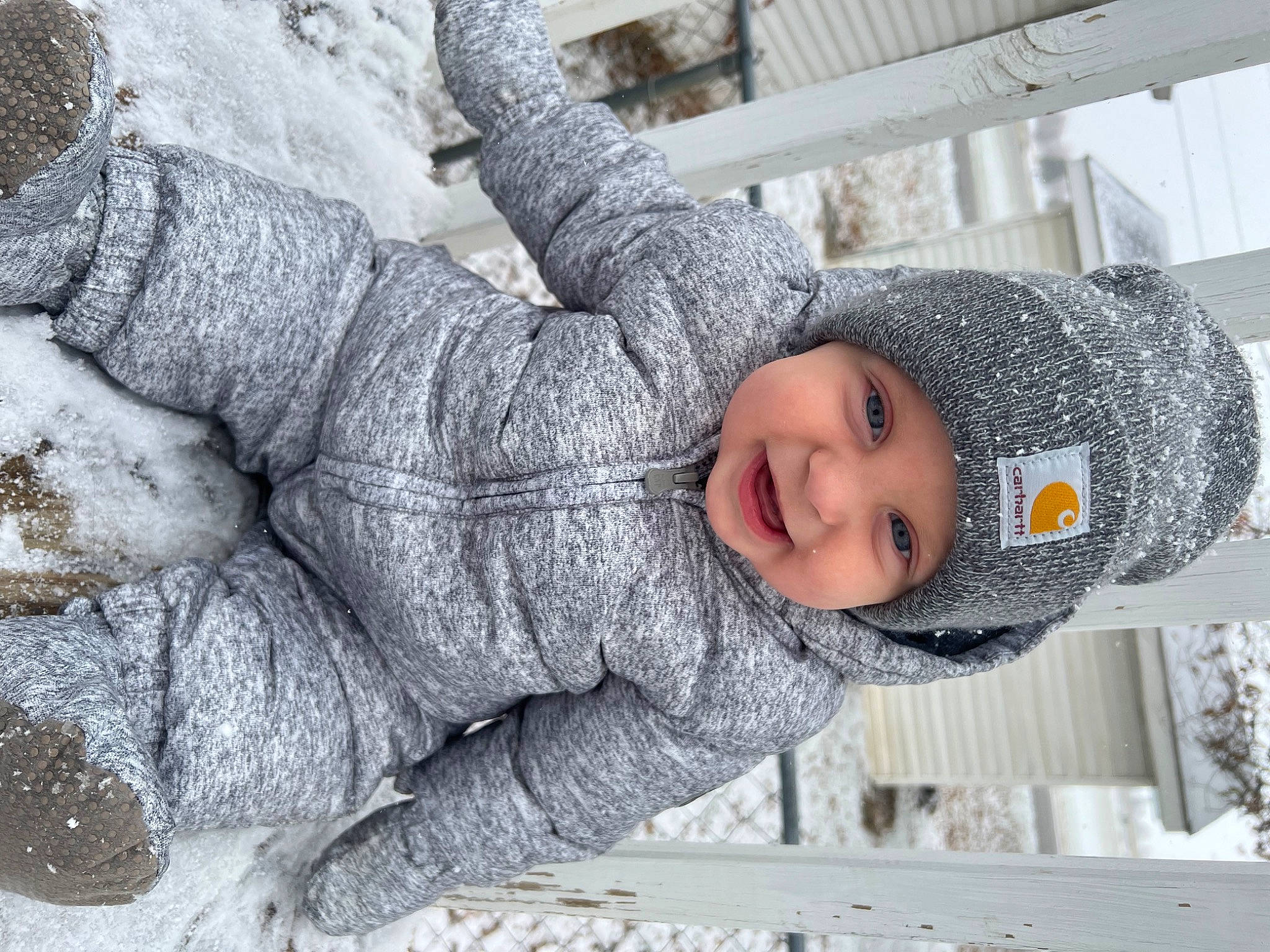 Coen joined the competition — help win amazing prizes! beanie, cap, cheek, child, freezing, fun, fur, gesture, happy, hat, headwear, knit_cap, person, playing_in_the_snow, portrait_photography, precipitation, sitting, smile, snow, toddler