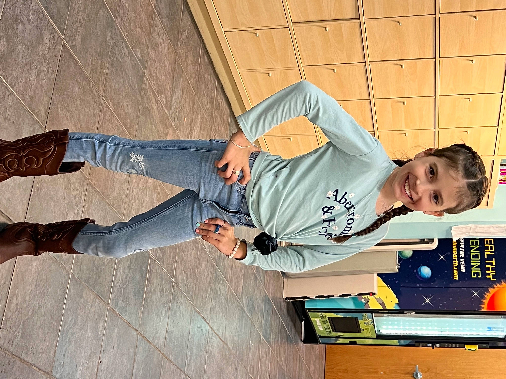 Chanel is registered to the contest to win money with this photo: denim, elbow, flash_photography, flooring, fun, happy, human_leg, joy, knee, leisure, pattern, person, sitting, smile, thigh, wood, wrist