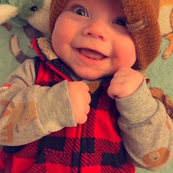 Enzo joined the competition — help win amazing prizes! baby, babylaughing, baseballcap, bonnet, cap, clothing, coat, face, happy, hat, head, hood, jacket, knitwear, laughing, person, photography, portrait, smile, sweater