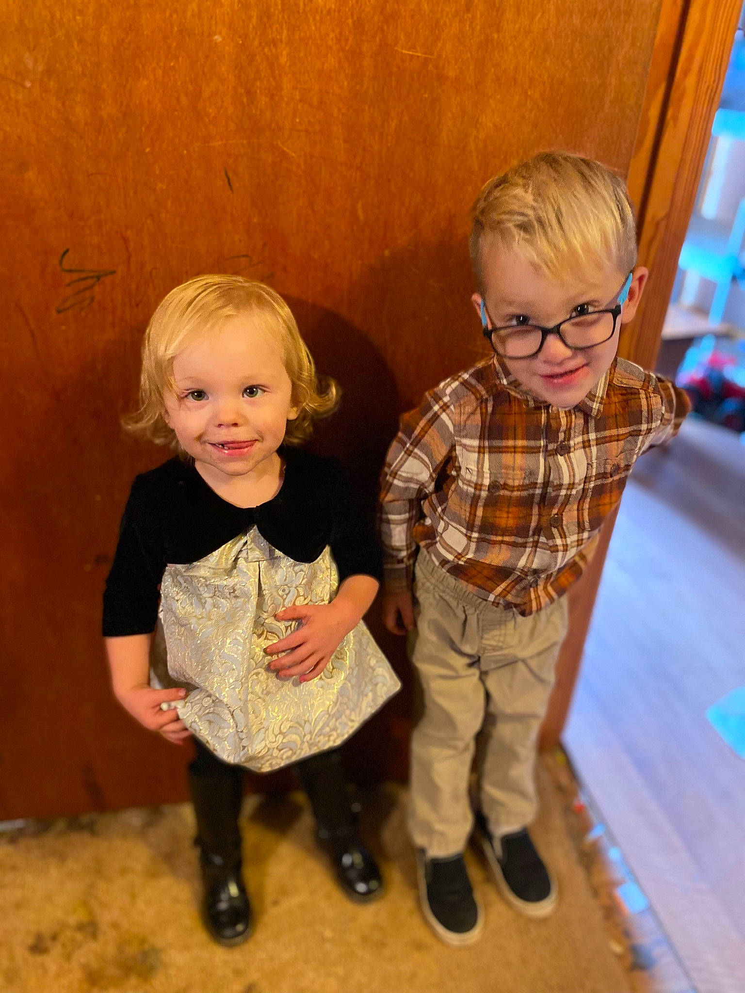 Aryanna is registered to the contest to win money with this photo: eye, face, facial_expression, floor, flooring, fun, glasses, hairstyle, happy, human, human_body, iris, joy, nose, person, skin, sleeve, smile, standing, toddler