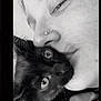 affection, animal, black_and_white, cat, close_up, cozy, cute, eyes, face, fur, human, indoor, intimacy, love, nose_ring, person, pet, portrait, snuggle, whiskers