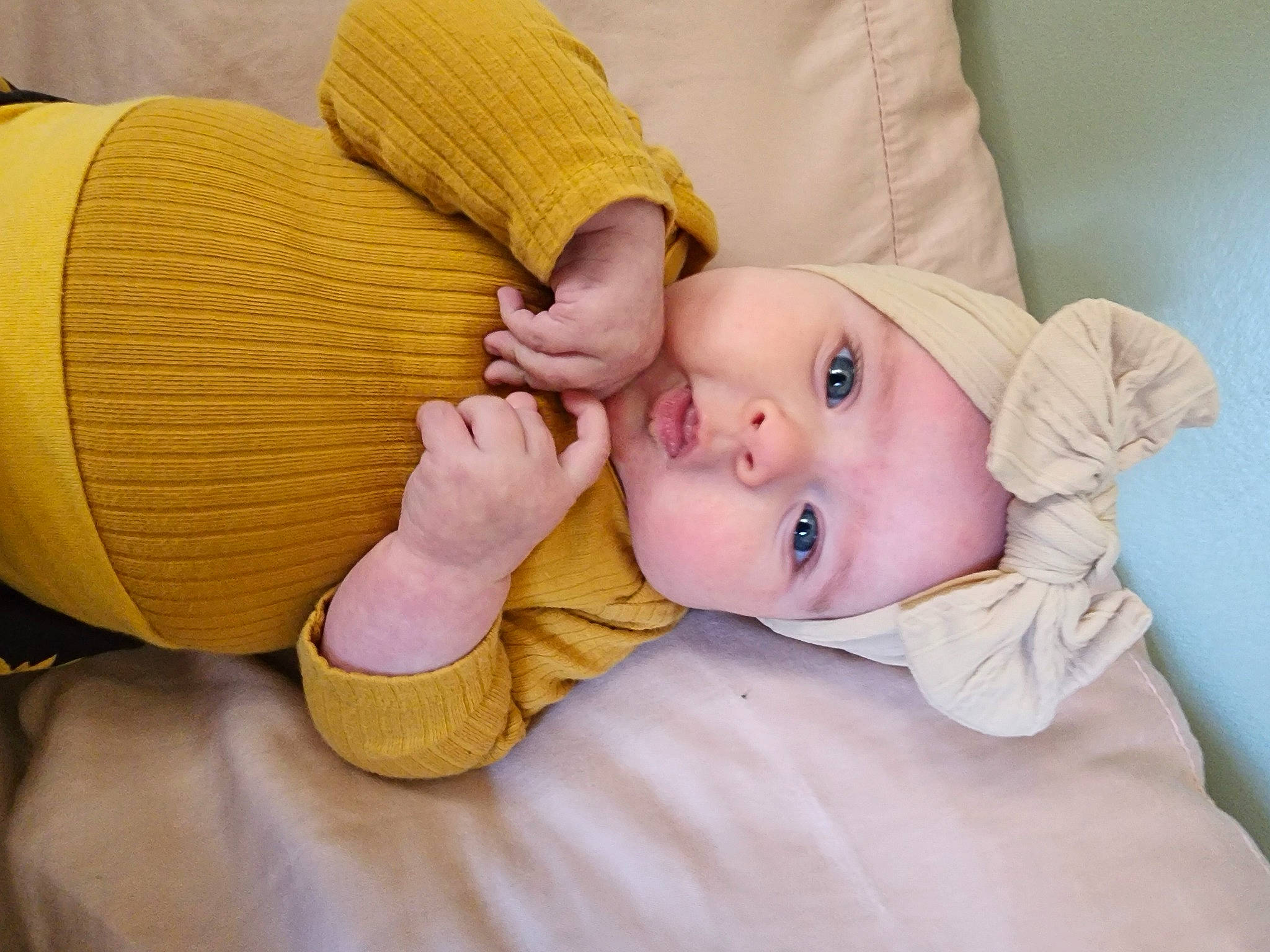 Olivia is registered to the contest to win money with this photo: baby, baby_sleeping, baby_toddler_clothing, cheek, child, comfort, eye, fashion_accessory, finger, gesture, headwear, human_leg, nail, person, product, sitting, skin, sleeve, textile, thumb