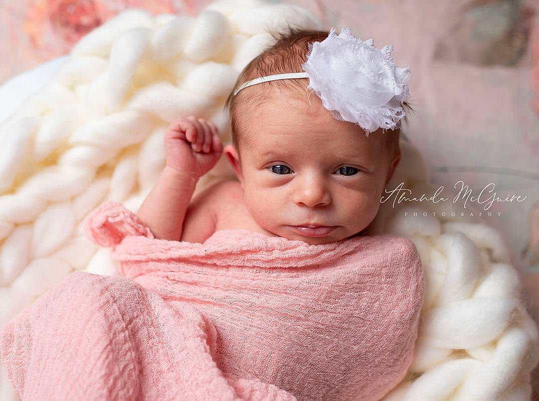 Charlotte is registered to the contest to win money with this photo: baby, baby_sleeping, blanket, cheek, child, face, fashion_accessory, fur, hair_accessory, head, headband, headgear, headpiece, person, pink, skin, smile, textile, toddler