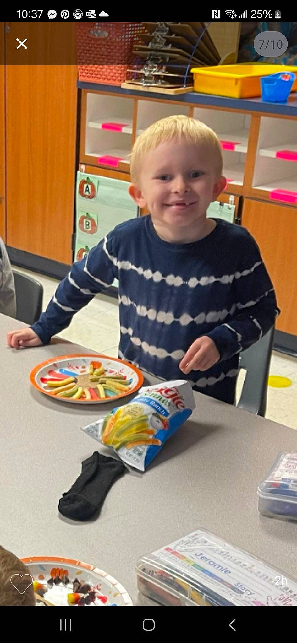 Dakota is registered to the contest to win money with this photo: chair, child, comfort_food, cooking, event, finger_food, food, fun, games, joy, junk_food, person, plate, play, recipe, room, sharing, smile, t_shirt, table
