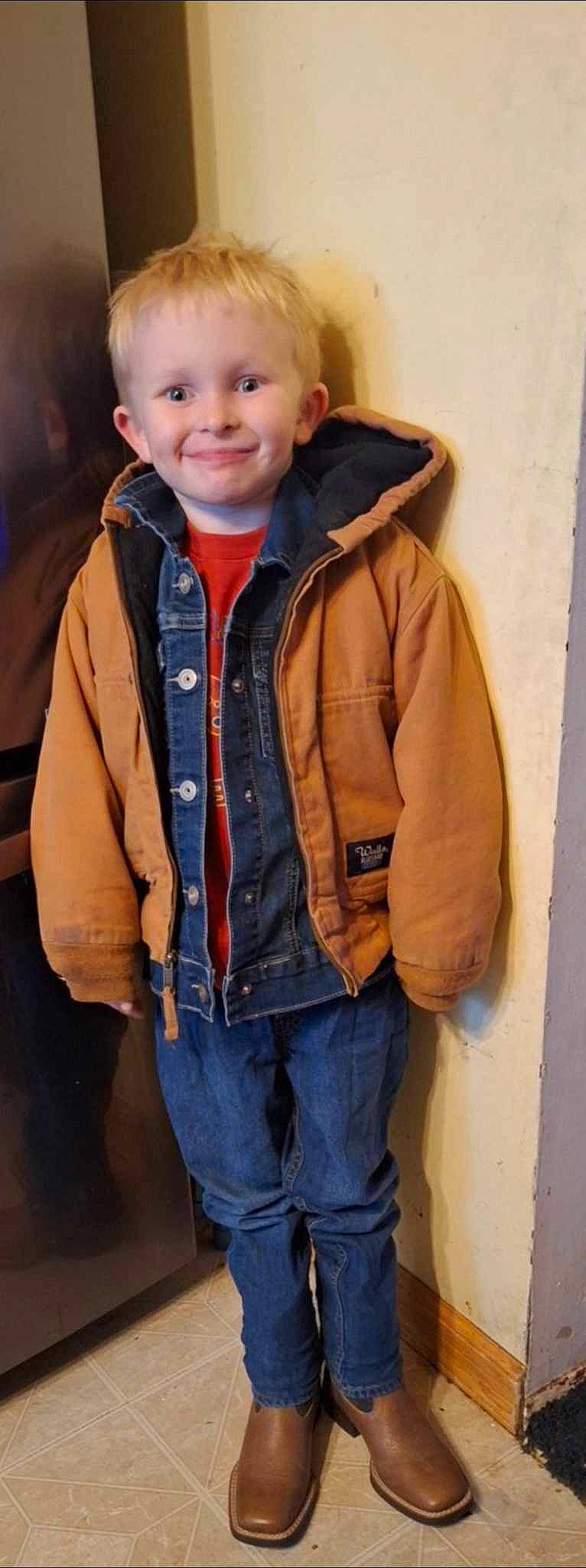 Dakota is registered to the contest to win money with this photo: button, cheek, child, clothing, collar, denim, electric_blue, eye, fashion_accessory, fur, happy, hood, jacket, joy, person, portrait_photography, sleeve, smile, toddler, top