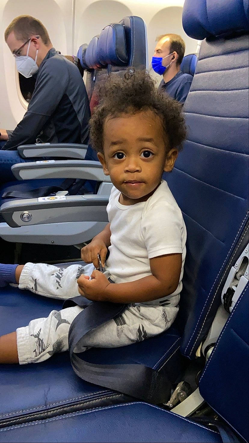 Nasir is registered to the contest to win money with this photo: baby_products, bag, chair, child, family_car, fun, happy, joint, lap, leisure, luggage_and_bags, luxury_vehicle, motor_vehicle, passenger, person, public_transport, shorts, sitting, t_shirt, toddler